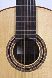 Soundhole and fretboard of classical guitar by luthier Daniel Desjardins